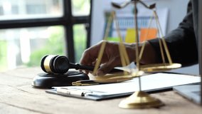 Lawyer or judge holding Hammer prepares to judge the case with justice, and litigation, scales of justice, law hammer, Legal consulting services, Concept of litigation, and legal services. - Powered by Shutterstock - Get 15% off with code: PIKWIZARD15