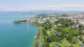 Inscription on video. Lausanne, Switzerland. Flight over the central part of the city. The coast of Lake Geneva. Heat burns text, Aerial View