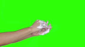 Hands are being cleaned using soap. green background - Powered by Shutterstock - Get 15% off with code: PIKWIZARD15