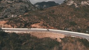 Cyclist riding bicycle in mountains. Pro road cyclist climbing steep uphill surrounded by big mountain peaks in Spain. Triathlete cycling on bike in springtime in Alicante, Spain. Active sport - Powered by Shutterstock - Get 15% off with code: PIKWIZARD15