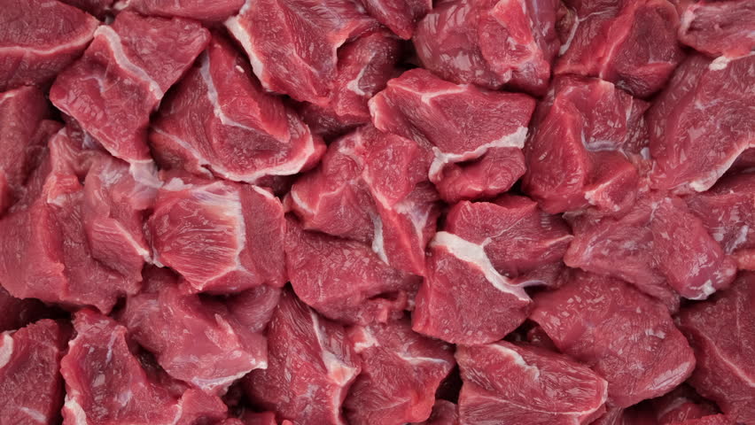 Raw pieces of beef top view, rotation. Prepare beef for cooking Royalty-Free Stock Footage #1100682079