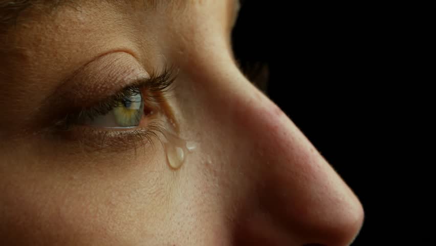 A Tear Running Down a Young Beautiful Woman Face, Macro Royalty-Free Stock Footage #1100685527