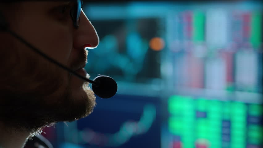 Trader is working with computer. Screen with stock charts and data analysis. Broker trading online. Concept of bitcoin BTC and stock market or crypto trading. | Shutterstock HD Video #1100687445