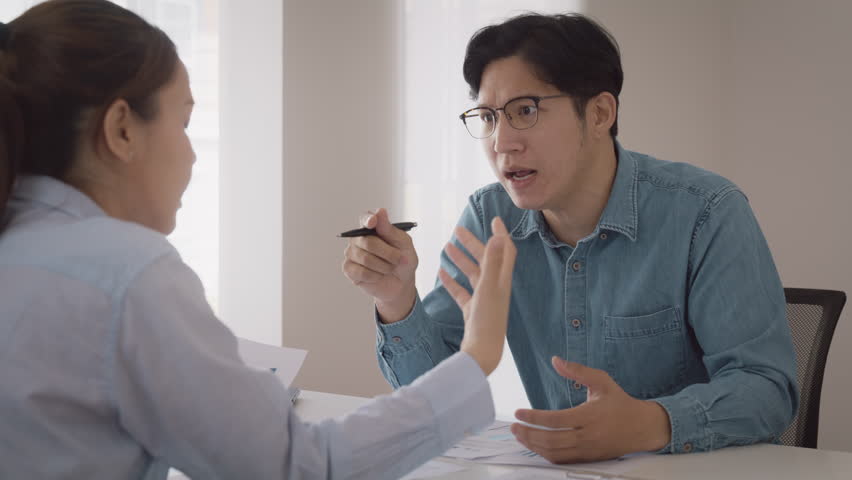 Bad CEO boss work argue point face stress rude yelling anger hate speech at female coworker. Two adult asia people man woman fight on meeting at office upset mad bossy male worker. Career job issue. | Shutterstock HD Video #1100692765