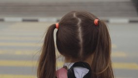 child with backpack crosses road pedestrian crossing. running child pedestrian crossing sign. zebra road near school. cars let child running school for lesson class. running child bag school concept. - Powered by Shutterstock - Get 15% off with code: PIKWIZARD15