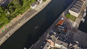 Exeter City Centre Aerial Drone video. Images along the River Exe near to Exeter Quay. People using the bike paths and river to row on