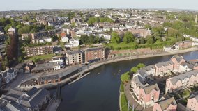 Exeter City Centre Aerial Drone video. Images along the River Exe near to Exeter Quay. People using the bike paths and river to row on