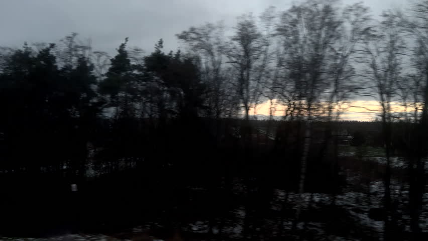 Defocused view from the train window. Cloudy morning outside the train windows.