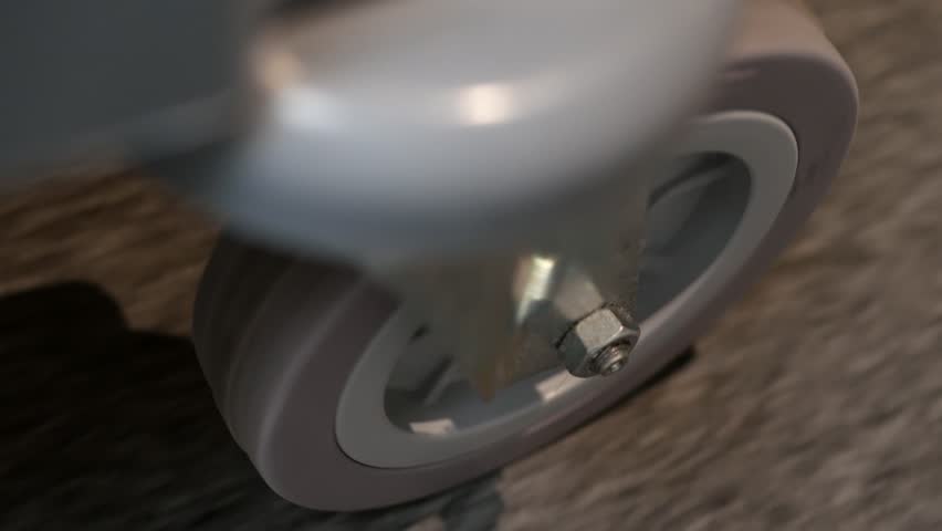 Close-up of the wheel of a guest luggage trolley in a hotel. top view