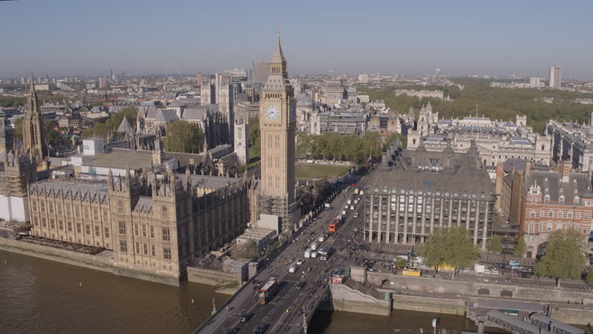High angle aerial drone shot flying towards Westminster and Big Ben over the River Thames | Shutterstock HD Video #1100703881
