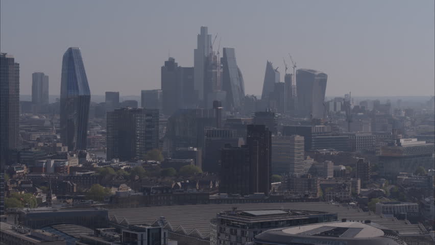 Drone telephoto descending shot of London skyline on bright clear sunny day | Shutterstock HD Video #1100703939