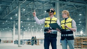 Employees using virtual reality. VR, 3d reality at industrial factory facility. - Powered by Shutterstock - Get 15% off with code: PIKWIZARD15