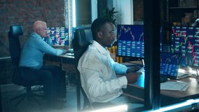 A team of stockbrokers are working in the office. Financial, investment, business concept. - Powered by Shutterstock - Get 15% off with code: PIKWIZARD15