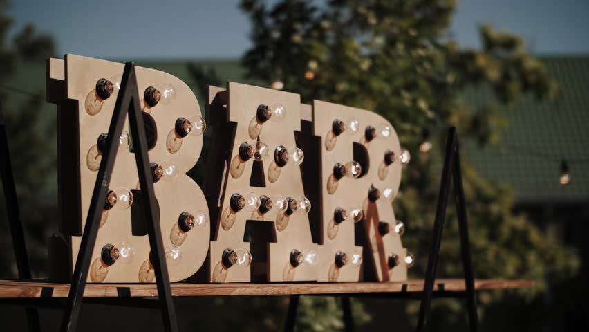 wooden street sign bar with light bulbs