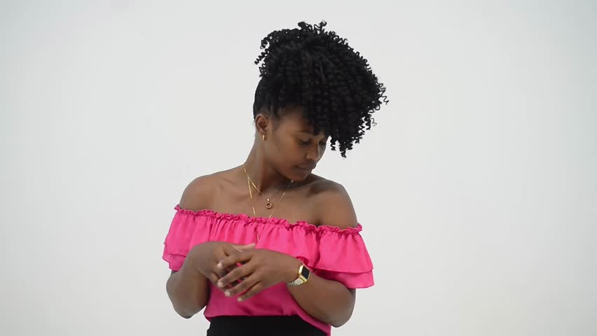 Sad young man holding cheek is looking down is reflecting