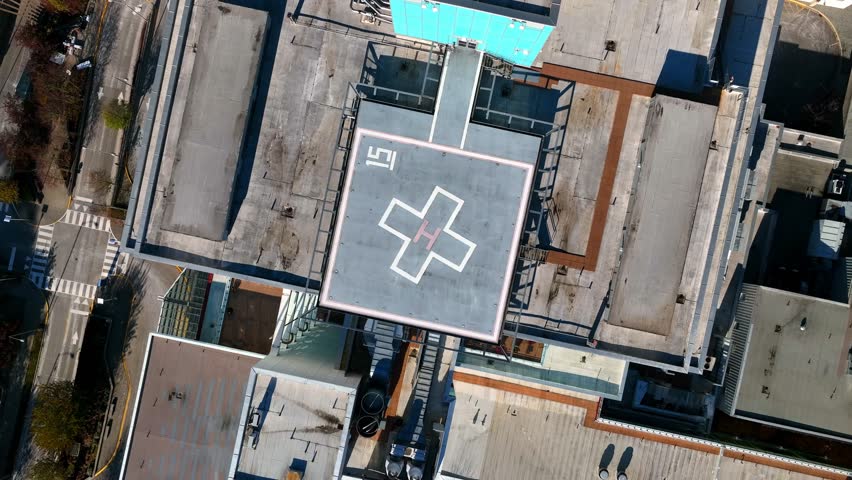 Helicopter Sign For Landing At The Roof Of Surrey Memorial Hospital Building In Canada - aerial top down