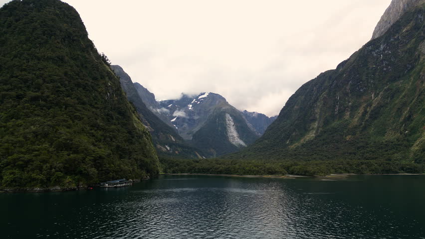 Milford Sound Underwater Observatory With Mount Pembroke In The Background In New Zealand. - aerial sideway