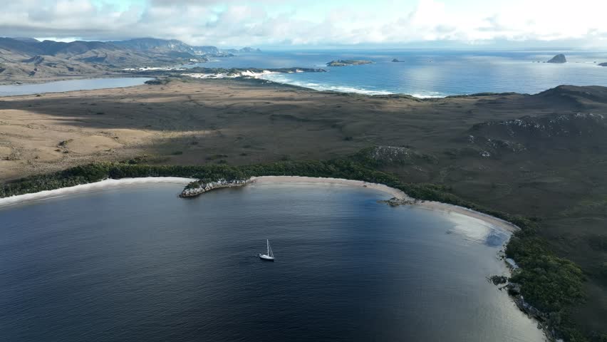 flying over a yacht over a lake in the wilderness with no people