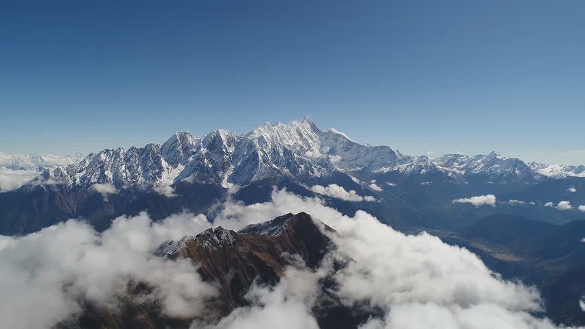 Daylight view of Mount Everest, Lhotse and Nuptse and the rest of Himalayan range from air. Sagarmatha National Park, Khumbu valley, Nepal. Royalty-Free Stock Footage #1100721871