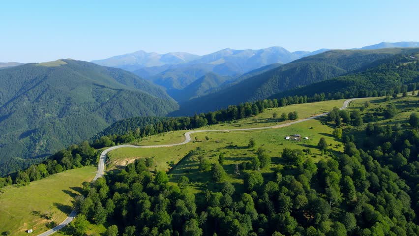 Aerial drone footage of a Romanian mountain road – Transalpina. It is a 148 km national road located in the Southern Carpathians of Romania and is one of the highest roads of the Carpathian Mountains. Royalty-Free Stock Footage #1100724581