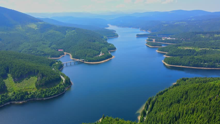 Aerial drone footage of a Oasa Lake from Sureanu mountains, Alba county, Transalpina, Transylvania, Romania.