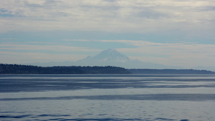 Magnificent view of the massive Mount Rainier seen from Seattle and the ferry over the Puget Sound