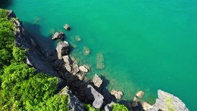 A stunning tropical sea coast with green forests and rocks, captured by a drone in Thailand. Perfect for summer travel stock footage videos. nature and travel concept. aerial view. 4K background
