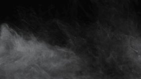 Abstract white smoke in slow motion. Smoke, Cloud of cold fog in light spot background. Light, white, fog, cloud, black background, 4k, ice smoke cloud. Floating fog. - Powered by Shutterstock - Get 15% off with code: PIKWIZARD15