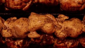 Video of grilled chicken cooking inside an oven. Peruvian gastronomy dish. Peruvian and South American food concept.