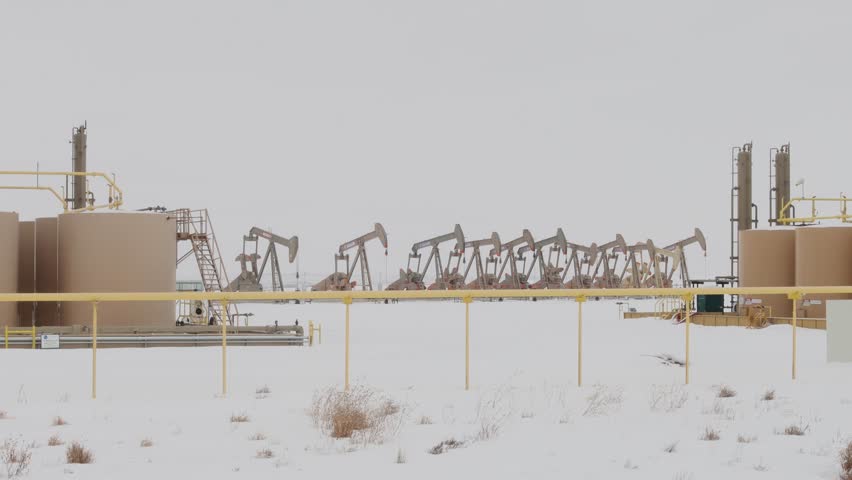 Pump Jacks in winter on the colorado plains. | Shutterstock HD Video #1100752055