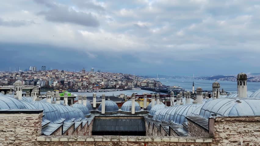 Blue Istanbul domes, roofs, rooftops and city view in overcast weather. Cityscape, architecture and bosphor