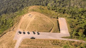 Aerial view video of a parking lot on a high mountain vantage point. in the national park Phitsanulok Province, Thailand