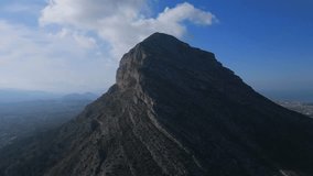 Aerial video panoramic view of the Montgo Massif in Denia, Spain.  Also known as Elephant Mountain and Mount Montgo. Parc Natural del Montgó, Javea, Spain. 