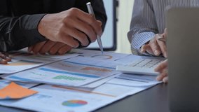 Financial analyst analysis business financial report on digital tablet during discussion at meeting of corporate showing the results of their successful teamwork., business meeting concept, Marketing	 - Powered by Shutterstock - Get 15% off with code: PIKWIZARD15