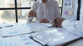 Financial analyst analysis business financial report on digital tablet during discussion at meeting of corporate showing the results of their successful teamwork., business meeting concept, Marketing	 - Powered by Shutterstock - Get 15% off with code: PIKWIZARD15