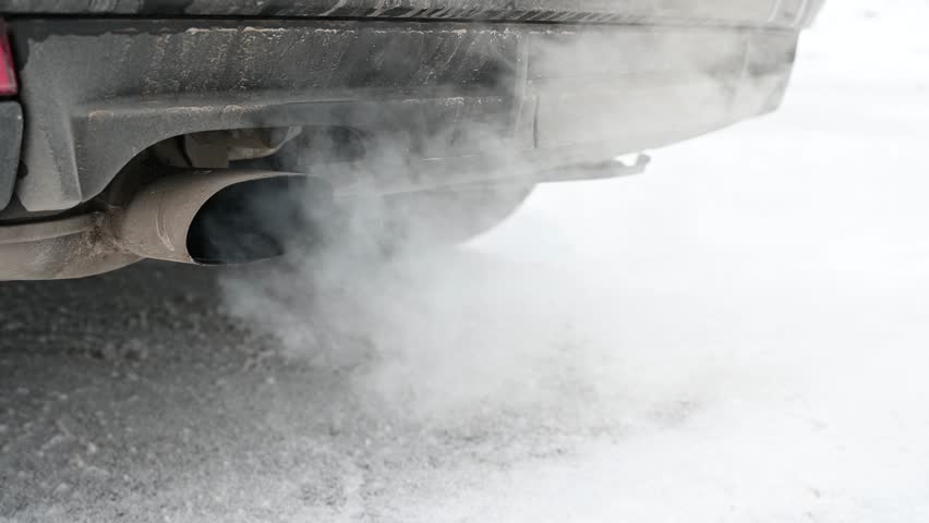 Smoke from car exhaust. Heavy air pollution. Exhaust fumes, close up. Smoke emission from vehicle.  | Shutterstock HD Video #1100763277