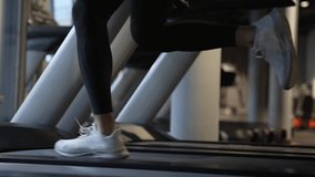Athlete running on fitness treadmill in gym. Treadmill workout of athlete. Fitness gym equipment. - Powered by Shutterstock - Get 15% off with code: PIKWIZARD15
