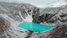 Bright blue Lagoon 69, Aerial, in the midst of the snowy mountains and glaciers, Peru, South America
