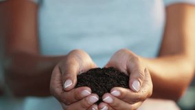 Video of woman hands holding soil. New life concept.
