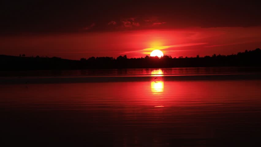 red sunset over the water	