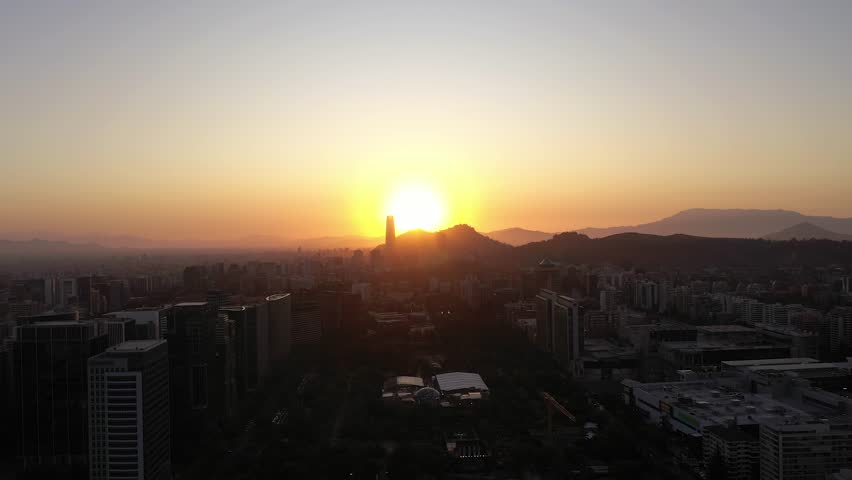 Santiago City Skyline at Sunset. Aerial View. Las Condes Commune. Chile. Drone Flies Forward