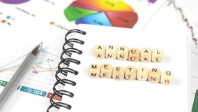 Business concept. Moving the camera from dollars to cubes with the inscription - Annual meeting - Powered by Shutterstock - Get 15% off with code: PIKWIZARD15