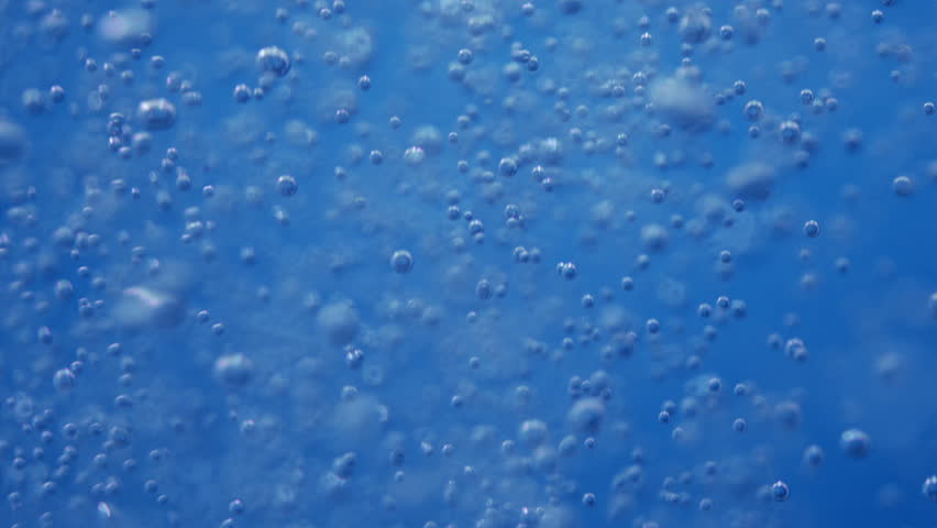 slow motion of sparkling water bubbles moving up Royalty-Free Stock Footage #1100790355