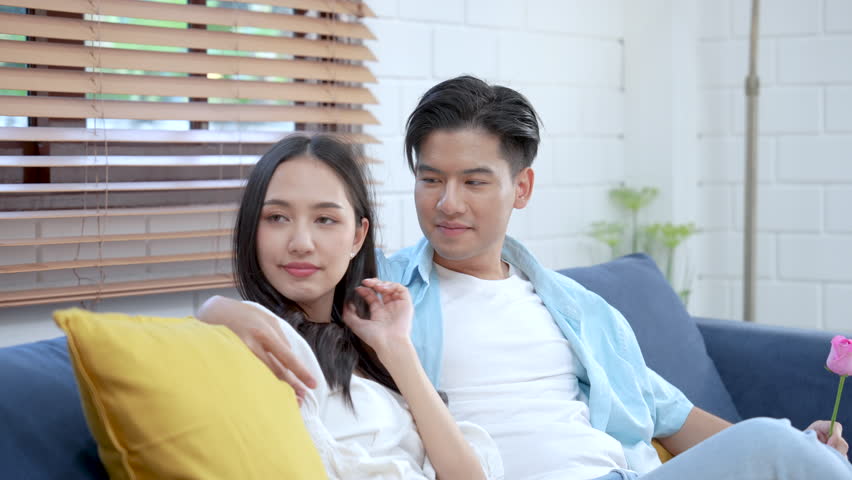 Happy Asian couple, Excited girlfriend receiving roses from boyfriend, Valentine's day or international women's day. Royalty-Free Stock Footage #1100791211
