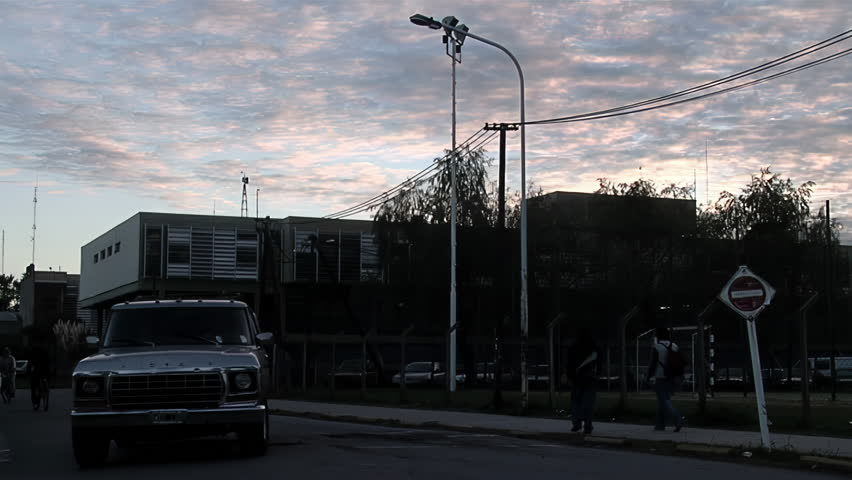 Buenos Aires, Argentina - May 2012: Technical Education School No.1 Hipolito Bouchard and Old Cars at Dawn in Escobar, Buenos Aires Province, Argentina.
