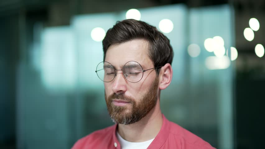 Close up portrait of mature business man freelancer relaxing alone during break at workplace Smiling peaceful worker with glasses enjoy calm deep breathing at work alone No stress happy people concept Royalty-Free Stock Footage #1100795841