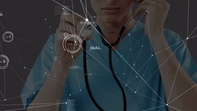 Animation of network of connections and data processing over caucasian doctor using stethoscope. global medicine, connections and digital interface concept digitally generated video.