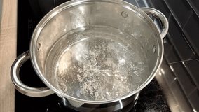 Boiling water in a saucepan on an induction panel
