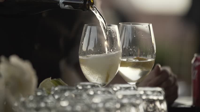 Serving Bubbly Champagne Two Glasses Blurred Background Hand Off Drinks