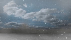 Animation of snow falling in seamless loop over clouds on blue sky in background. winter, christmas, tradition and celebration concept digitally generated video.